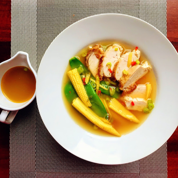 Green tea and ginger clear soup with chicken and steamed vegetables